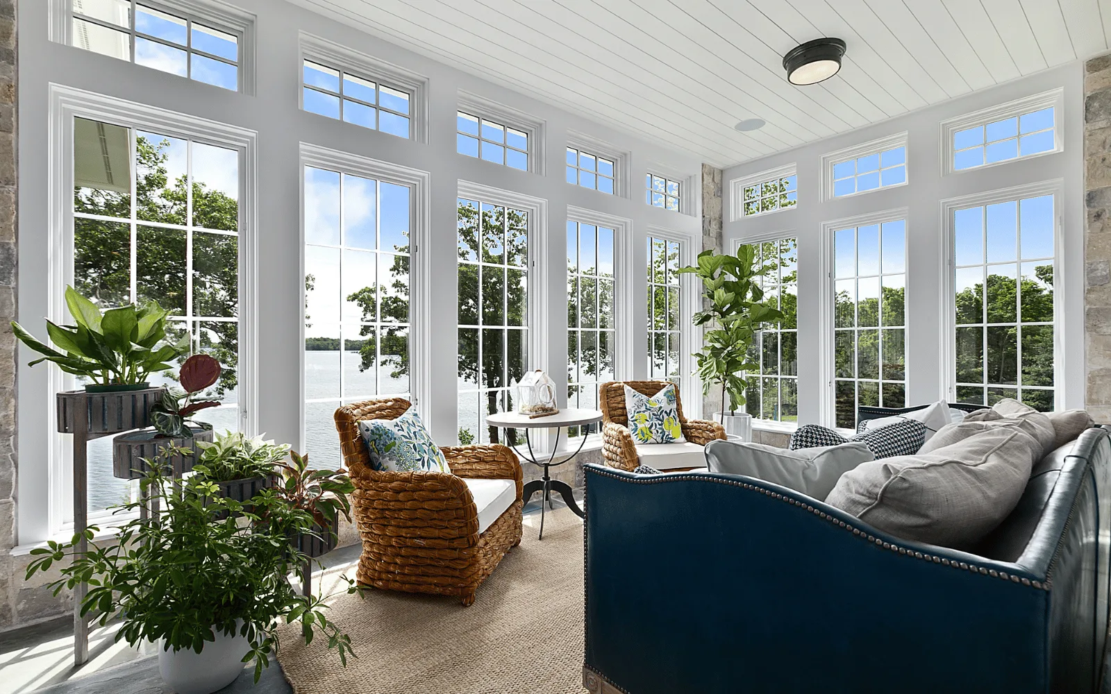Tall windows facing the water in a home with a bay view