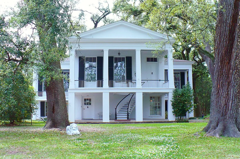 Two-story home with tall windows